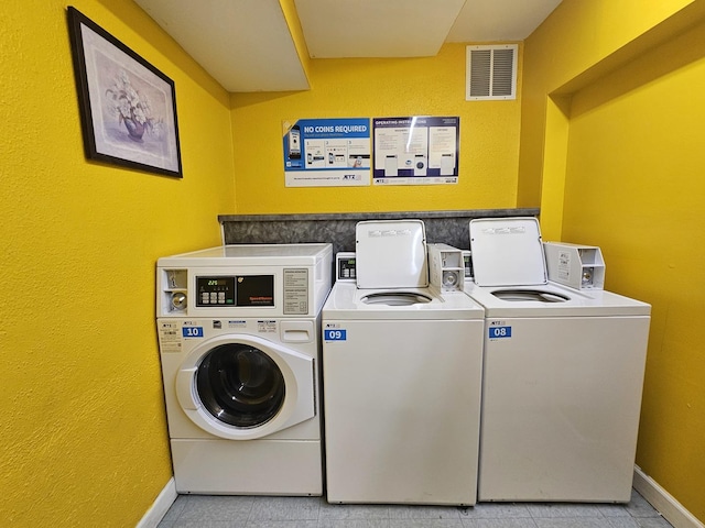 2 Oak Creek Dr Unit 3207, Buffalo Grove, IL 60089 - shared laundry room with washer and clothes dryer, baseboards, and light tile patterned flooring