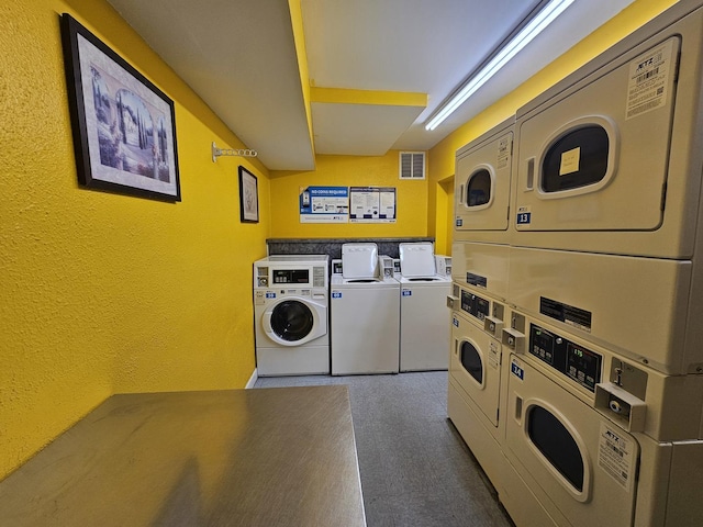 2 Oak Creek Dr Unit 3207, Buffalo Grove, IL 60089 - community laundry featuring estacked washer and dryer, independent washer and dryer, and a textured wall