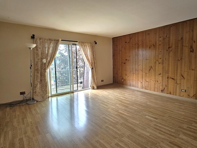 2 Oak Creek Dr Unit 3207, Buffalo Grove, IL 60089 - unfurnished room with wooden walls, wood finished floors, and baseboards