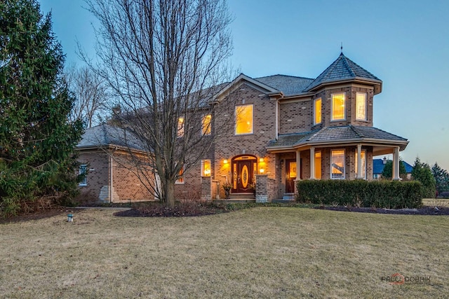 38868 Oakcrest Ln, Wadsworth, IL 60083 - view of front of property with brick siding, a front yard, and a high end roof