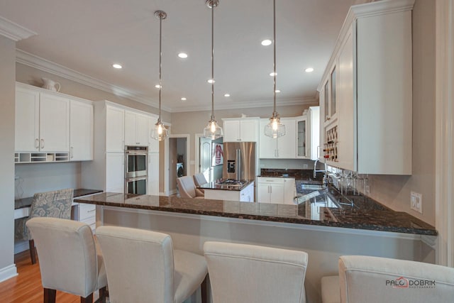 38868 Oakcrest Ln, Wadsworth, IL 60083 - kitchen featuring stainless steel appliances, dark stone counters, a peninsula, crown molding, and glass insert cabinets