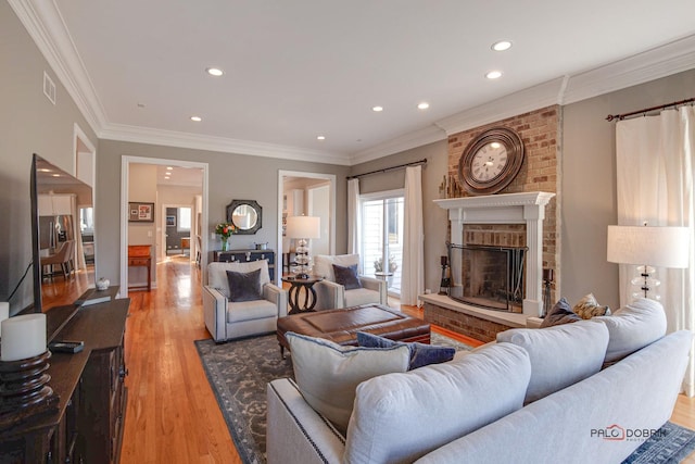 38868 Oakcrest Ln, Wadsworth, IL 60083 - living room with a fireplace, light wood-style flooring, recessed lighting, and ornamental molding