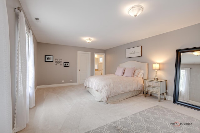 38868 Oakcrest Ln, Wadsworth, IL 60083 - bedroom with light carpet, baseboards, and connected bathroom