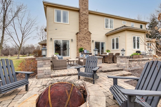 38868 Oakcrest Ln, Wadsworth, IL 60083 - rear view of property with a patio, a chimney, and an outdoor hangout area