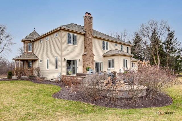 38868 Oakcrest Ln, Wadsworth, IL 60083 - back of property with a chimney and a lawn
