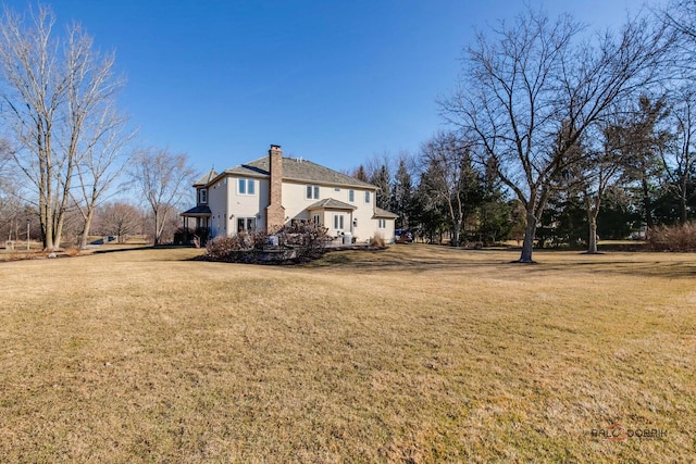 38868 Oakcrest Ln, Wadsworth, IL 60083 - view of home's exterior with a yard and a chimney