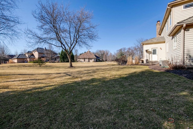 38868 Oakcrest Ln, Wadsworth, IL 60083 - view of grassy yard with central air condition unit