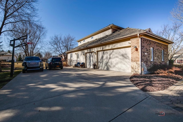 38868 Oakcrest Ln, Wadsworth, IL 60083 - view of home's exterior with brick siding, driveway, and a garage