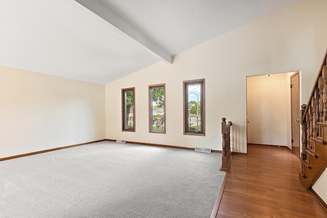 7565 174th St, Tinley Park, IL 60477 - empty room with baseboards, beam ceiling, stairway, light wood-style flooring, and high vaulted ceiling