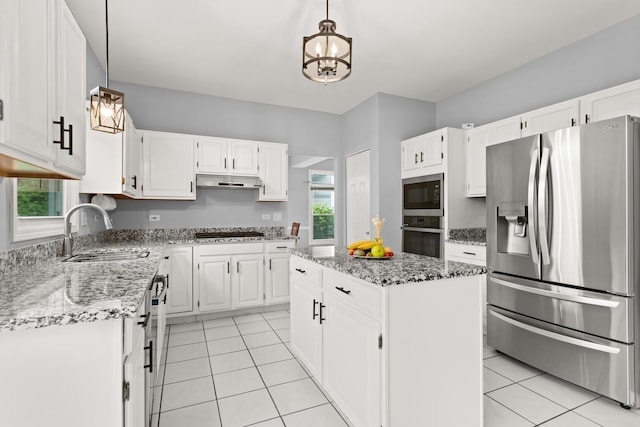857 Bluestem Dr, Bolingbrook, IL 60440 - kitchen with stainless steel appliances, light stone counters, a chandelier, a sink, and white cabinetry