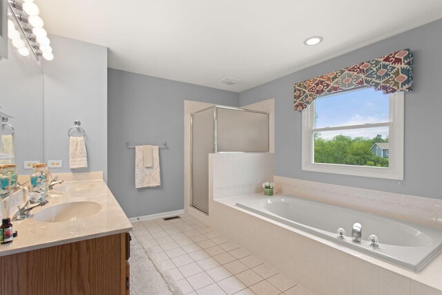 857 Bluestem Dr, Bolingbrook, IL 60440 - bathroom with a garden tub, double vanity, a shower stall, and tile patterned flooring