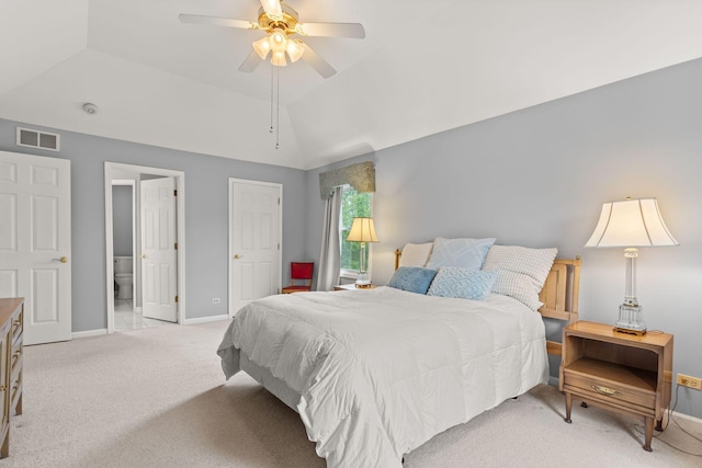 857 Bluestem Dr, Bolingbrook, IL 60440 - bedroom with light colored carpet, baseboards, vaulted ceiling, ensuite bathroom, and a ceiling fan