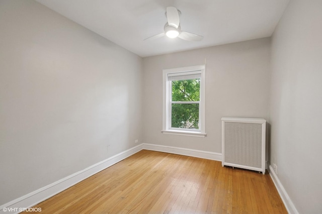 1620 W Olive Ave Unit 3A, Chicago, IL 60660 - empty room with baseboards, light wood-type flooring, ceiling fan, and radiator heating unit