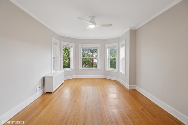 1620 W Olive Ave Unit 3A, Chicago, IL 60660 - spare room with ceiling fan, light wood-style floors, baseboards, radiator, and ornamental molding
