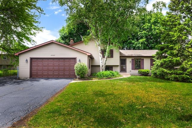 30W265 Briar Ln, Naperville, IL 60563 - tri-level home featuring asphalt driveway, an attached garage, and a front yard