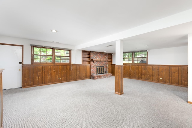 30W265 Briar Ln, Naperville, IL 60563 - unfurnished living room featuring wooden walls, a wainscoted wall, a fireplace, plenty of natural light, and carpet