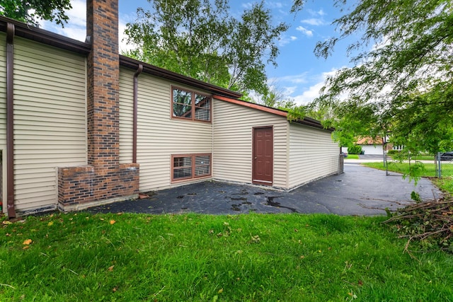 30W265 Briar Ln, Naperville, IL 60563 - view of property exterior featuring a patio and a chimney