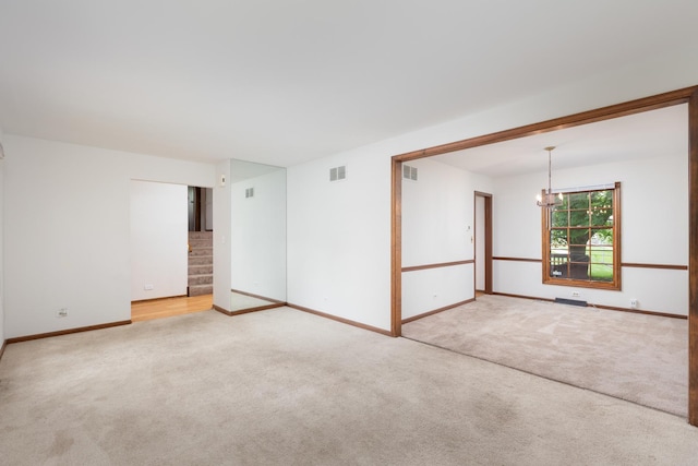 30W265 Briar Ln, Naperville, IL 60563 - carpeted empty room featuring a chandelier, baseboards, and stairway