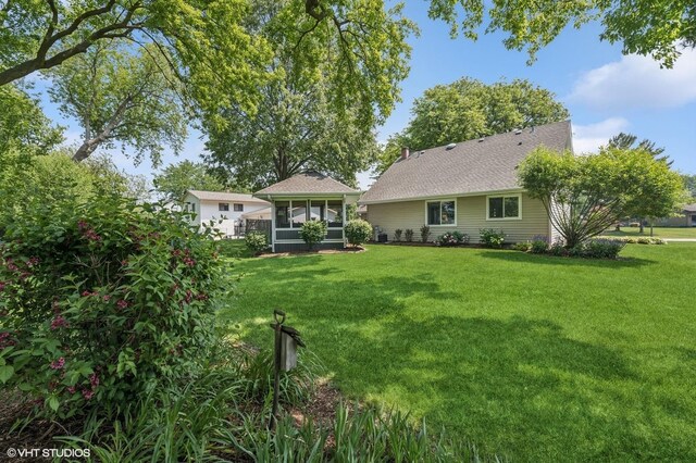 862 Wimbleton Ln, Crystal Lake, IL 60014 - back of property featuring a sunroom and a lawn