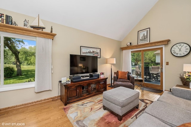 862 Wimbleton Ln, Crystal Lake, IL 60014 - living room with light wood-style flooring, high vaulted ceiling, and baseboards