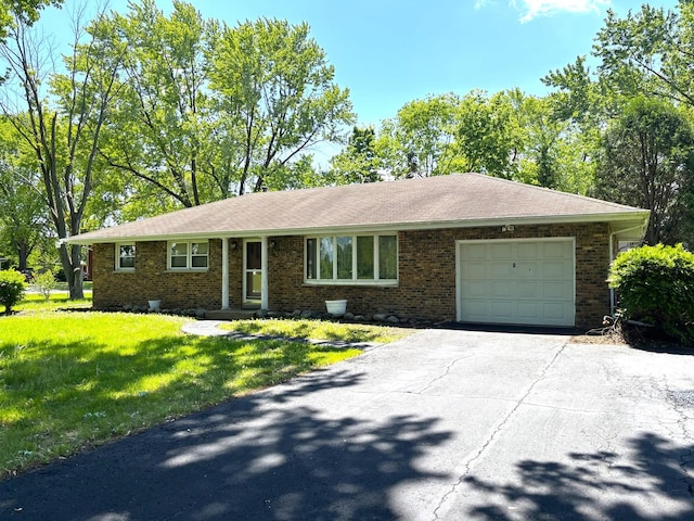 1 Marlin Dr, Oswego, IL 60543 - ranch-style home featuring an attached garage, driveway, a front lawn, and brick siding