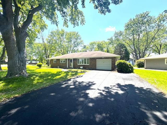 1 Marlin Dr, Oswego, IL 60543 - ranch-style house with driveway, a garage, a front yard, and brick siding