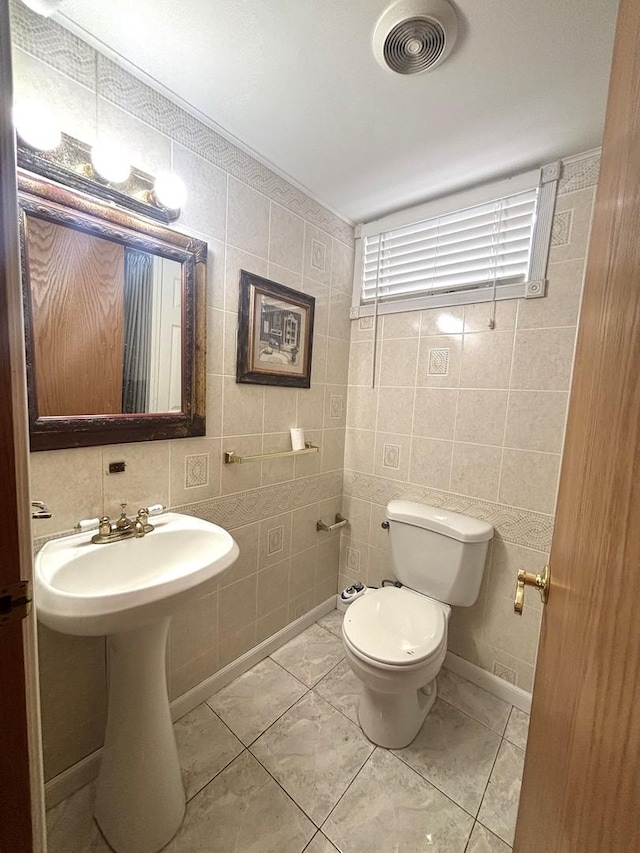 1 Marlin Dr, Oswego, IL 60543 - half bathroom featuring tile walls and toilet