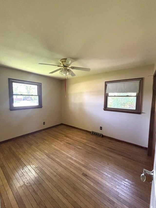 1 Marlin Dr, Oswego, IL 60543 - spare room with hardwood / wood-style floors, ceiling fan, and baseboards