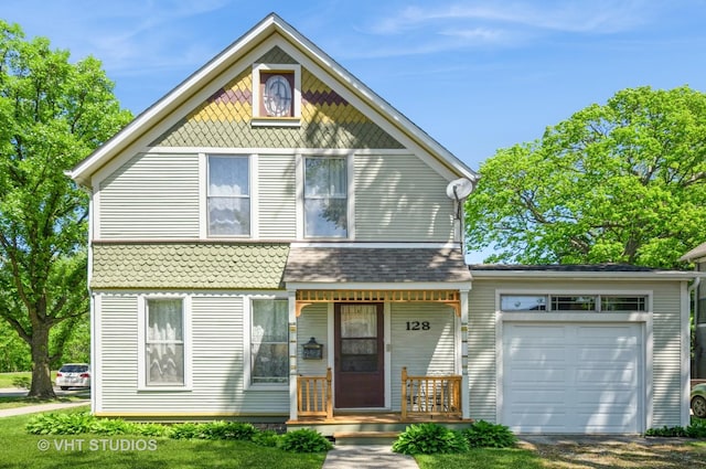 128 Forest Ave, Riverside, IL 60546 - victorian home with an attached garage and a porch