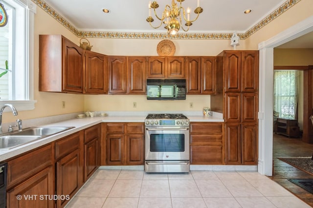 128 Forest Ave, Riverside, IL 60546 - kitchen with black appliances, a sink, plenty of natural light, and a chandelier