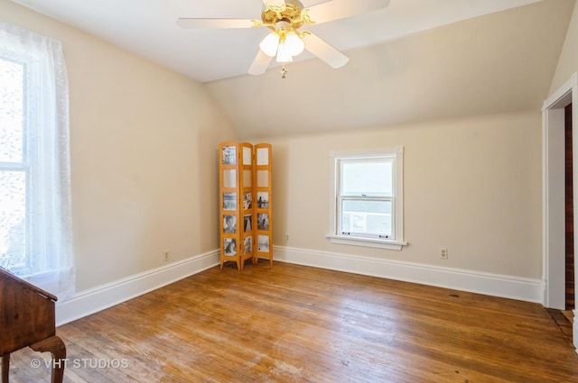 128 Forest Ave, Riverside, IL 60546 - spare room with wood finished floors, lofted ceiling, baseboards, and a ceiling fan