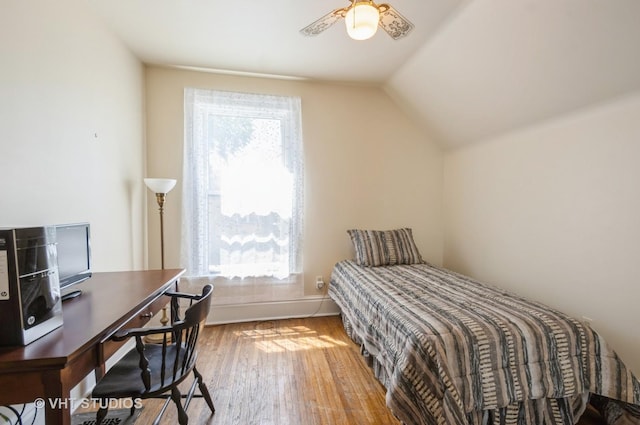 128 Forest Ave, Riverside, IL 60546 - bedroom with wood finished floors, lofted ceiling, an office area, and baseboards