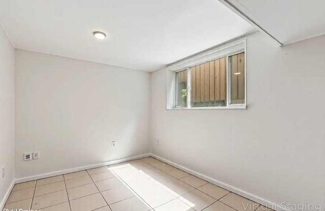 2110 Hermon Ave, Zion, IL 60099 - empty room featuring baseboards and tile patterned floors