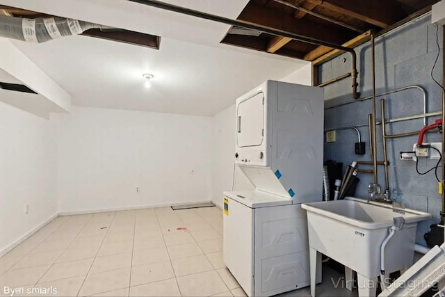 2110 Hermon Ave, Zion, IL 60099 - laundry area with estacked washer and dryer and baseboards