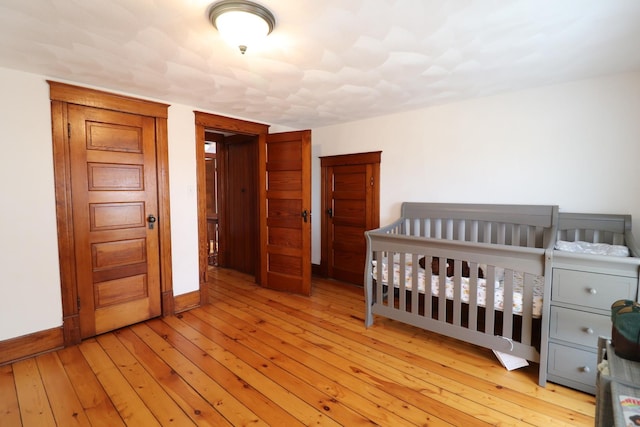 4977 N Mount Vernon Rd, Forreston, IL 61030 - bedroom with hardwood / wood-style floors and baseboards