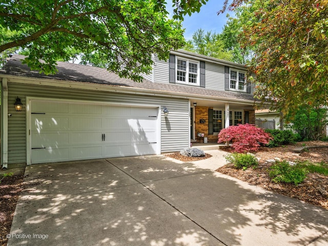 421 S River Rd, Naperville, IL 60540 - traditional home featuring driveway, a porch, a garage, and a shingled roof