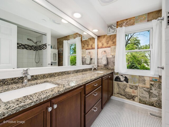 421 S River Rd, Naperville, IL 60540 - bathroom with double vanity, tile patterned floors, and a tile shower