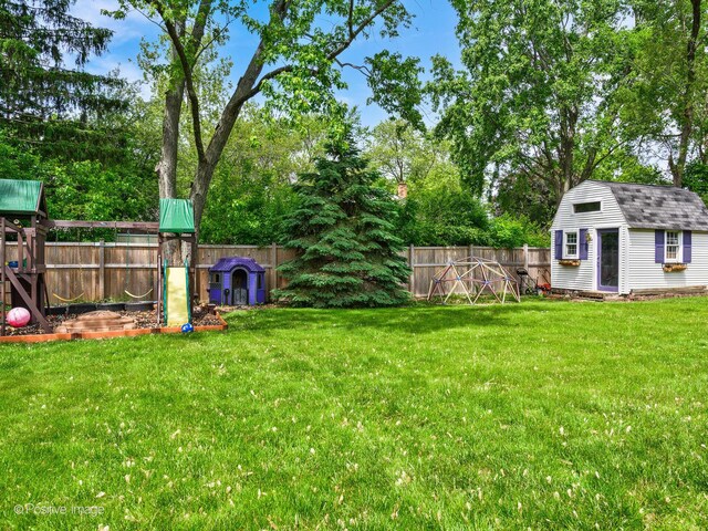 421 S River Rd, Naperville, IL 60540 - view of yard with a playground, an outbuilding, and view of scattered trees