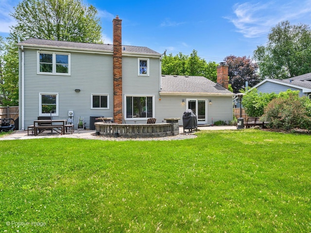 421 S River Rd, Naperville, IL 60540 - back of property with a chimney, a patio area, and a shingled roof