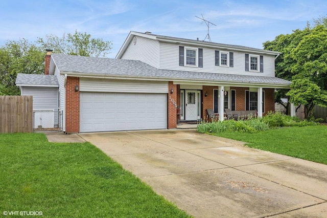 1005 69th St, Darien, IL 60561 - traditional home featuring a garage, a porch, driveway, and brick siding