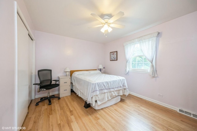 1005 69th St, Darien, IL 60561 - bedroom featuring light wood-style floors, baseboards, a closet, and a ceiling fan