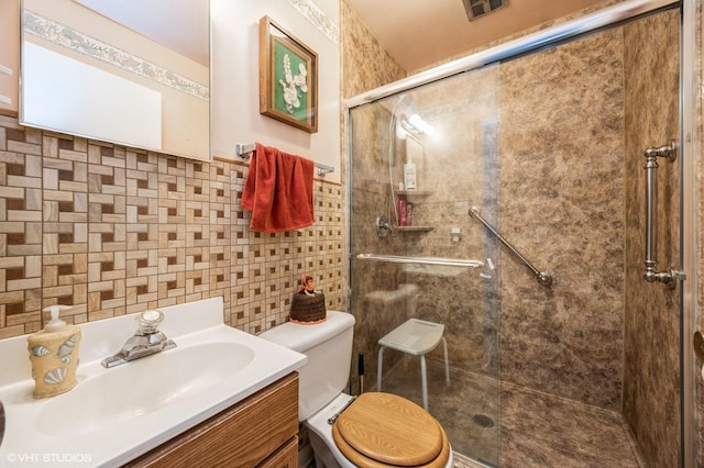 1005 69th St, Darien, IL 60561 - bathroom with toilet, a stall shower, vanity, and decorative backsplash