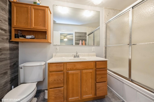 1005 69th St, Darien, IL 60561 - full bathroom featuring toilet, vanity, bath / shower combo with glass door, and a ceiling fan