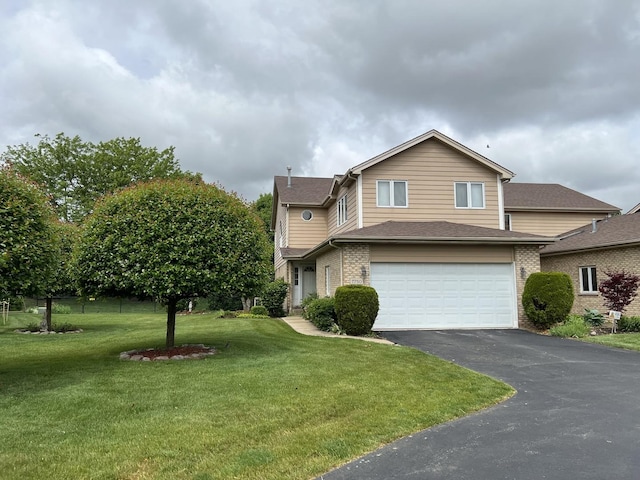 7750 Northfield Ln, Tinley Park, IL 60487 - traditional home featuring asphalt driveway, brick siding, a garage, and a front yard