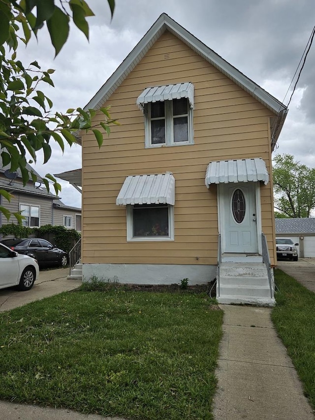 315 Vandalia St, Elgin, IL 60123 - view of front of home with a front yard and entry steps
