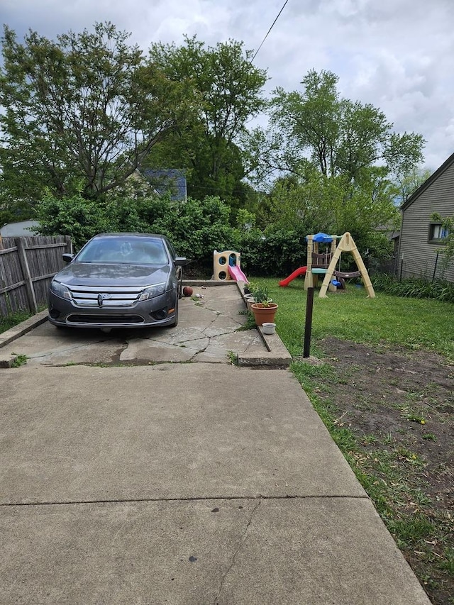 315 Vandalia St, Elgin, IL 60123 - view of yard featuring a playground and concrete driveway