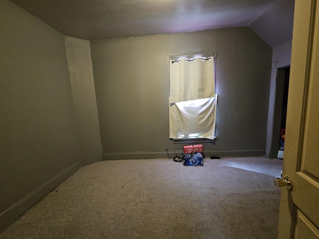 315 Vandalia St, Elgin, IL 60123 - spare room with carpet floors, baseboards, and vaulted ceiling