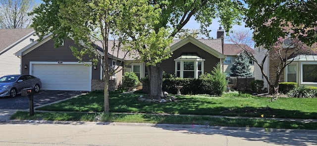 973 Willowbrook Dr, Wheeling, IL 60090 - view of front of home featuring a garage and driveway
