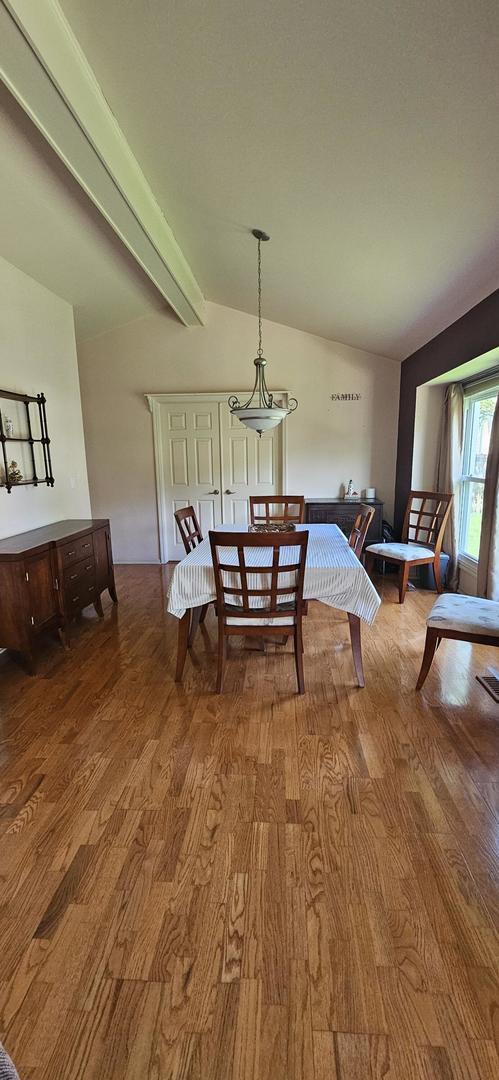 973 Willowbrook Dr, Wheeling, IL 60090 - dining room with wood finished floors and lofted ceiling