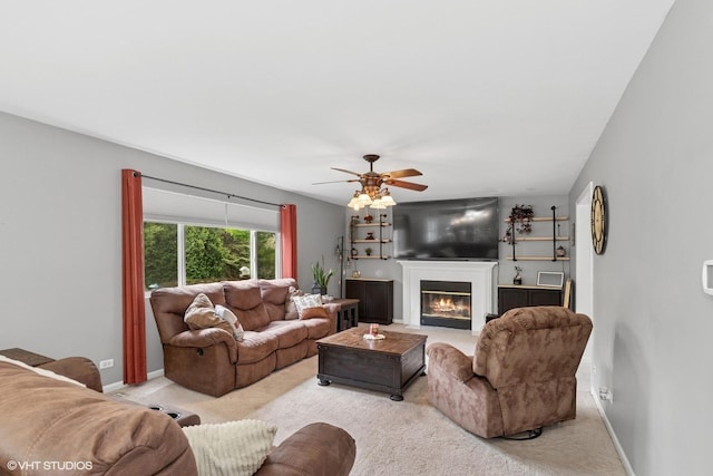 3175 N Magnolia Ln, Wadsworth, IL 60083 - carpeted living area with a glass covered fireplace, ceiling fan, and baseboards